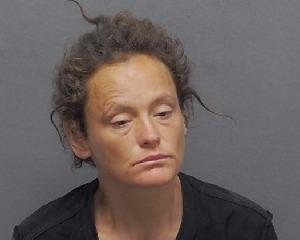 Woman in police mugshot for San Antonio crime investigation.