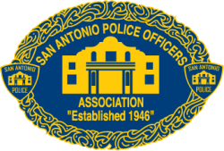 San Antonio Crime Stoppers badge with police emblem and established date.