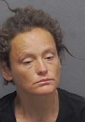 Woman in police mugshot for San Antonio crime investigation.